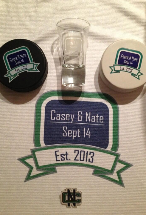 Hockey themed wedding guest favors - Power Towels, hockey pucks, pins