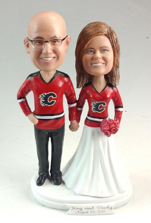 Bobble head wedding cake topper hockey themed